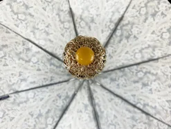 Cream paisley design with yellow stone