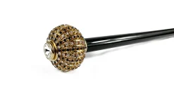 Walking stick with brass onion with black and white crystals